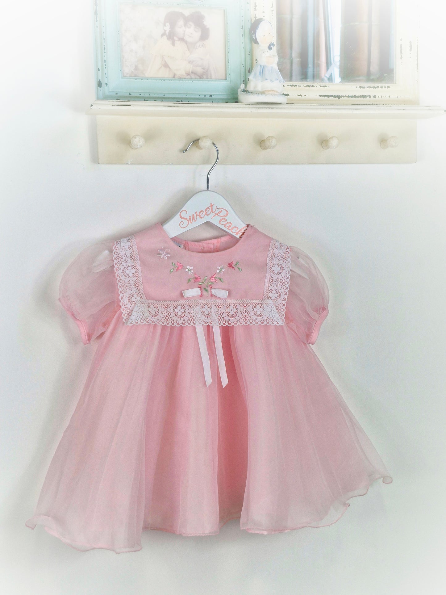 18-24 months. Pink Wildflowers by JC Penney. Lace trim on bib, embroidered with flowers