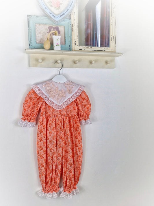 3-6 months. Floral romper with lace, embroidery and white bib