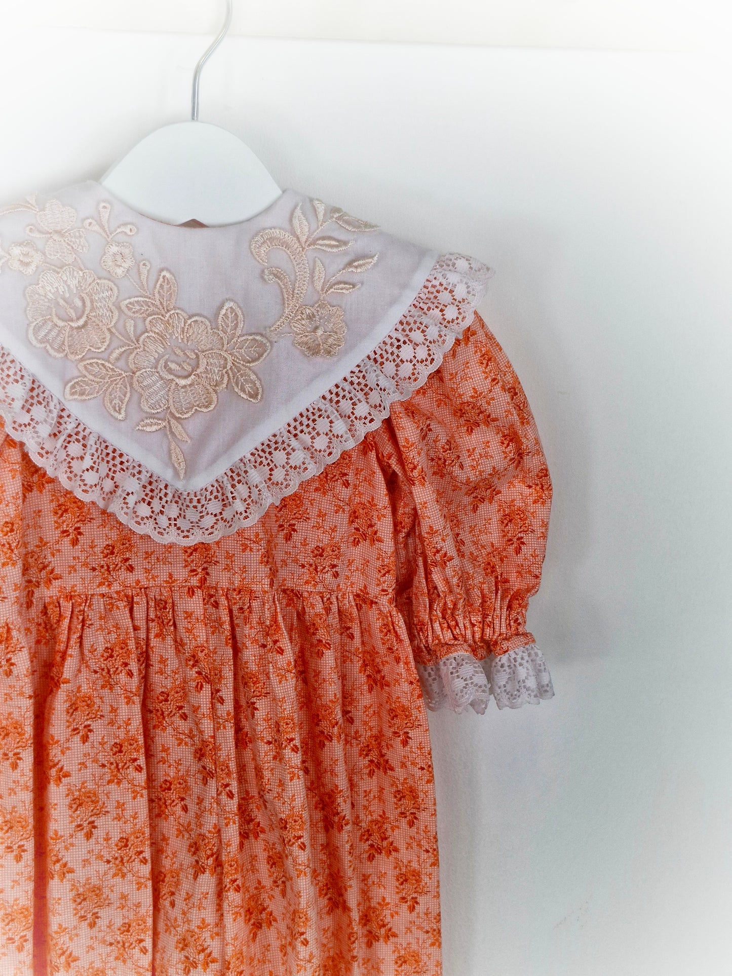 3-6 months. Floral romper with lace, embroidery and white bib