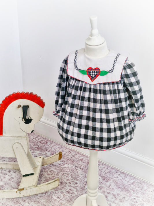 18-24 months. Black and white gingham vintage cradle togs dress with white bib and heart appliqué