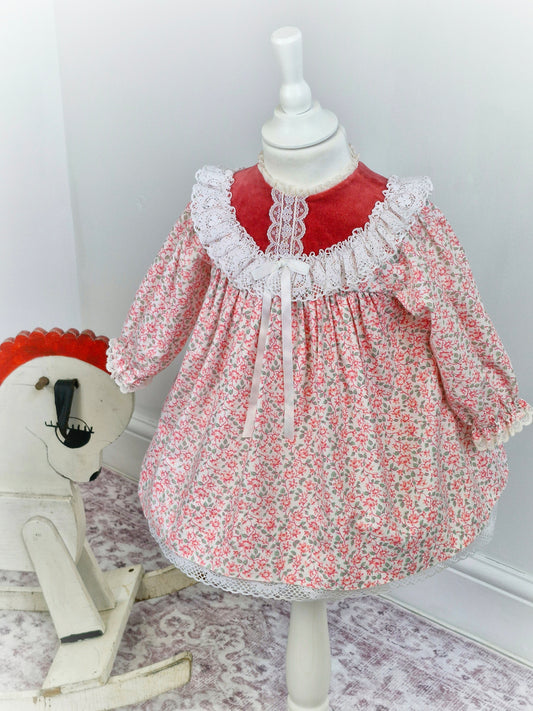2 years. Red and white floral Bryan with velour top, lace trim and ribbon