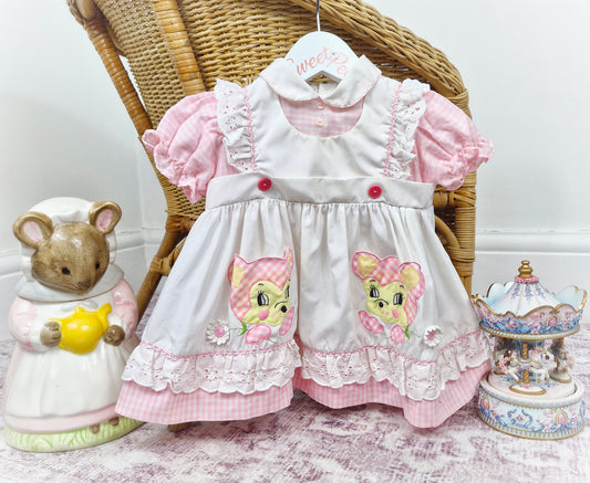 9-12 months. White and pink gingham dress, peter pan collar, pinny style and bear(?) motifs