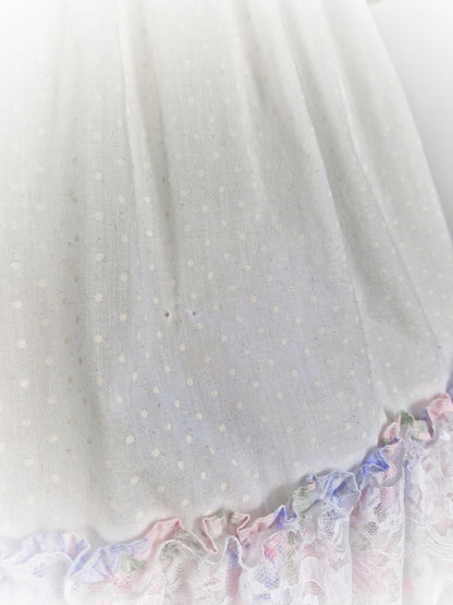 3 years. White dress with pastel flutter sleeves and hem. Cherry applique and lace details