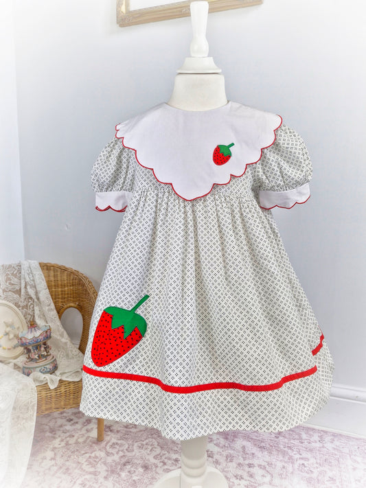 4 years. Vintage strawberry dress, off-white with dot patterns, white scalloped bib and sleeves with red trim