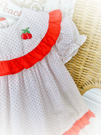 9-12 months. White with red polka dot vintage dress from Kiddie Korner, red frills and cherry applique