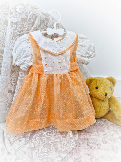 12-18 months. Handmade peach polka dot sheer dress with broderie anglais sleeves, bib and collar