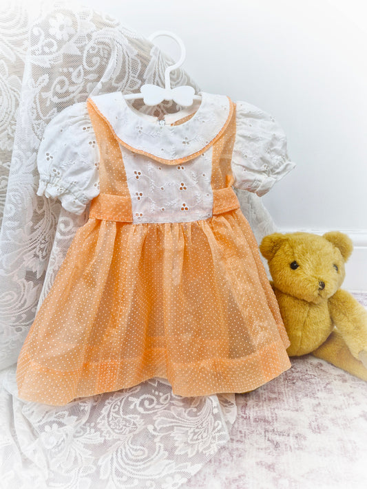 12-18 months. Handmade peach polka dot sheer dress with broderie anglais sleeves, bib and collar