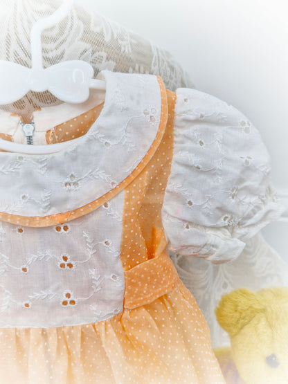 12-18 months. Handmade peach polka dot sheer dress with broderie anglais sleeves, bib and collar
