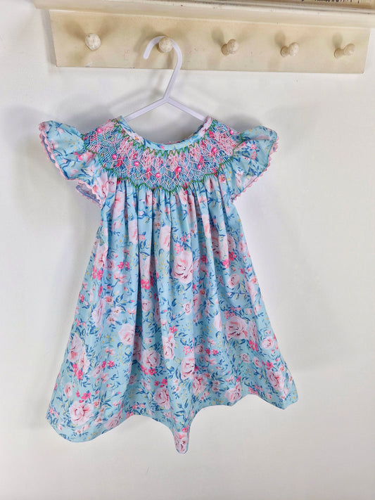 3 years. Vintage inspired Nola Smock. Blue and pinn floral dress with flutter sleeves