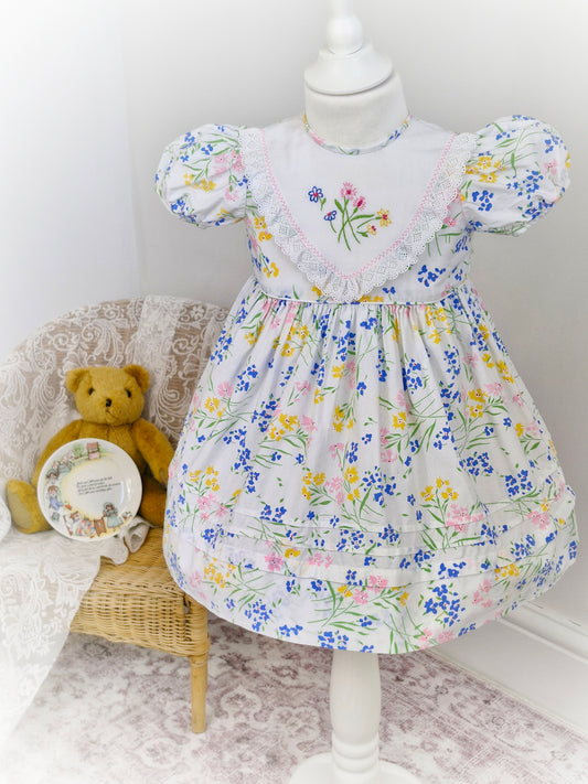 2 years. White floral vintage dress with embroidered bib