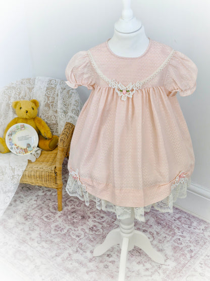 3-4 years. Light pink vintage Jolene with lace hem and delicate lace applique with pink ribbon rose
