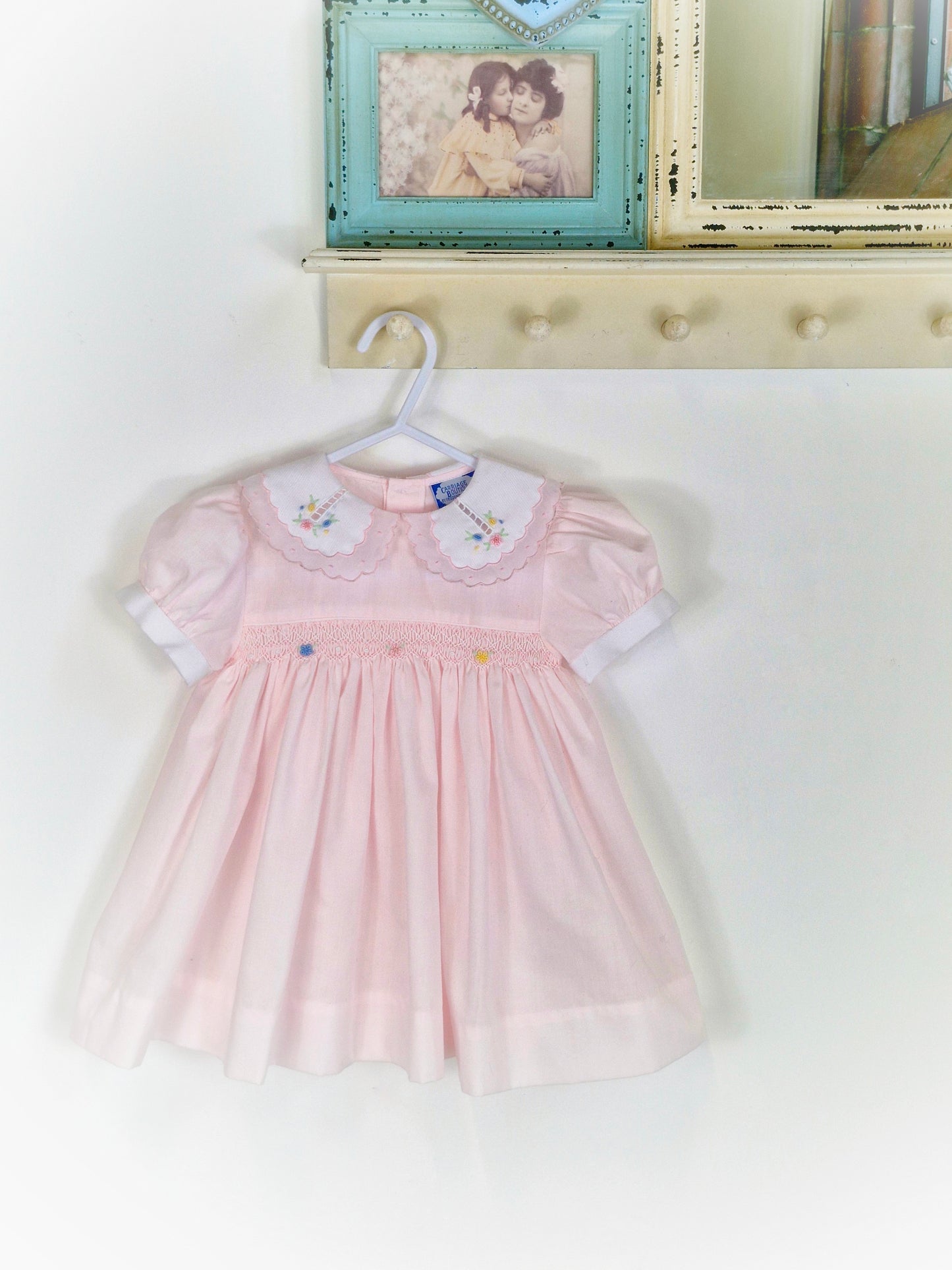 18 months. Pink vintage smock from Carriage Boutique with white collar