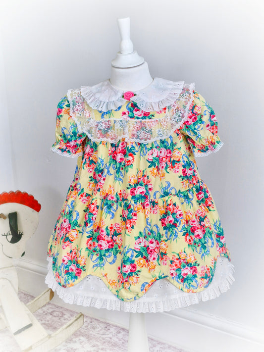 3-4 years. Lemon vintage dress with floral print, white broderie anglais bib and hem and white lace