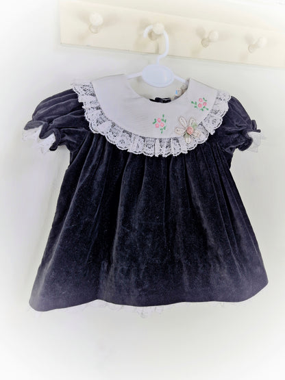 9-12 months. Black velvet vintage dress with white embroidered bib and lace hem