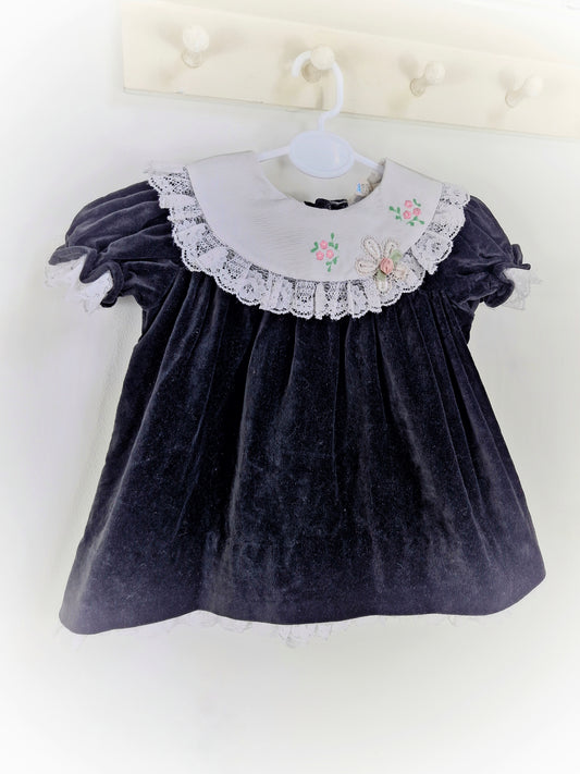 9-12 months. Black velvet vintage dress with white embroidered bib and lace hem