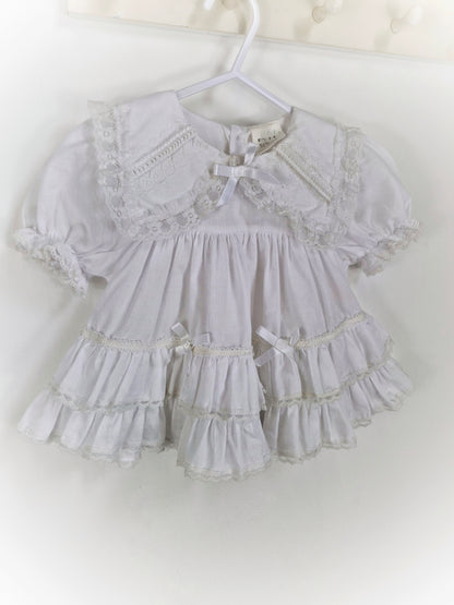 9-12 months. White frilly vintage dress with collar, lace and ribbon