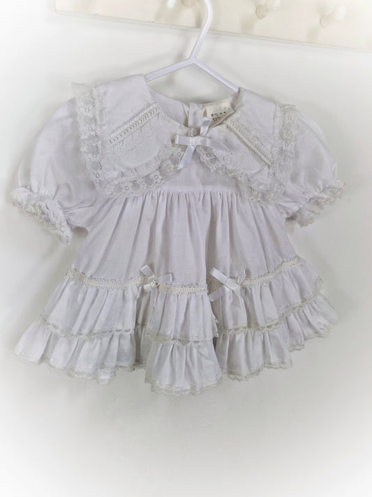 9-12 months. White frilly vintage dress with collar, lace and ribbon