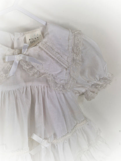 9-12 months. White frilly vintage dress with collar, lace and ribbon