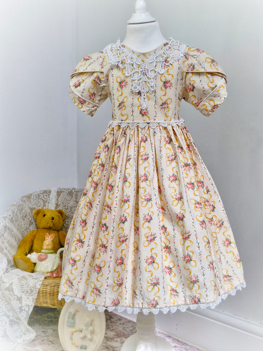 6 years. Handmade, victorian style, puff sleeves, lace trim neckline. Striped dress with floral bouquets