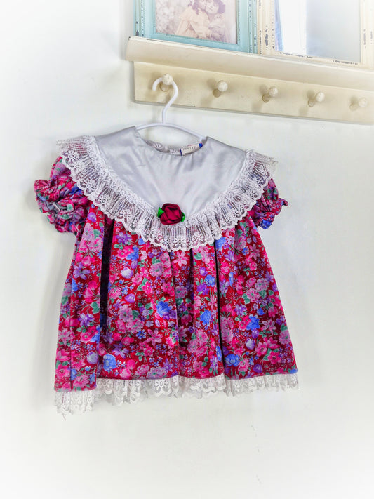 18-24 months. Vintage floral soft velvet dress with white bib and lace trim from Sweet Liberty