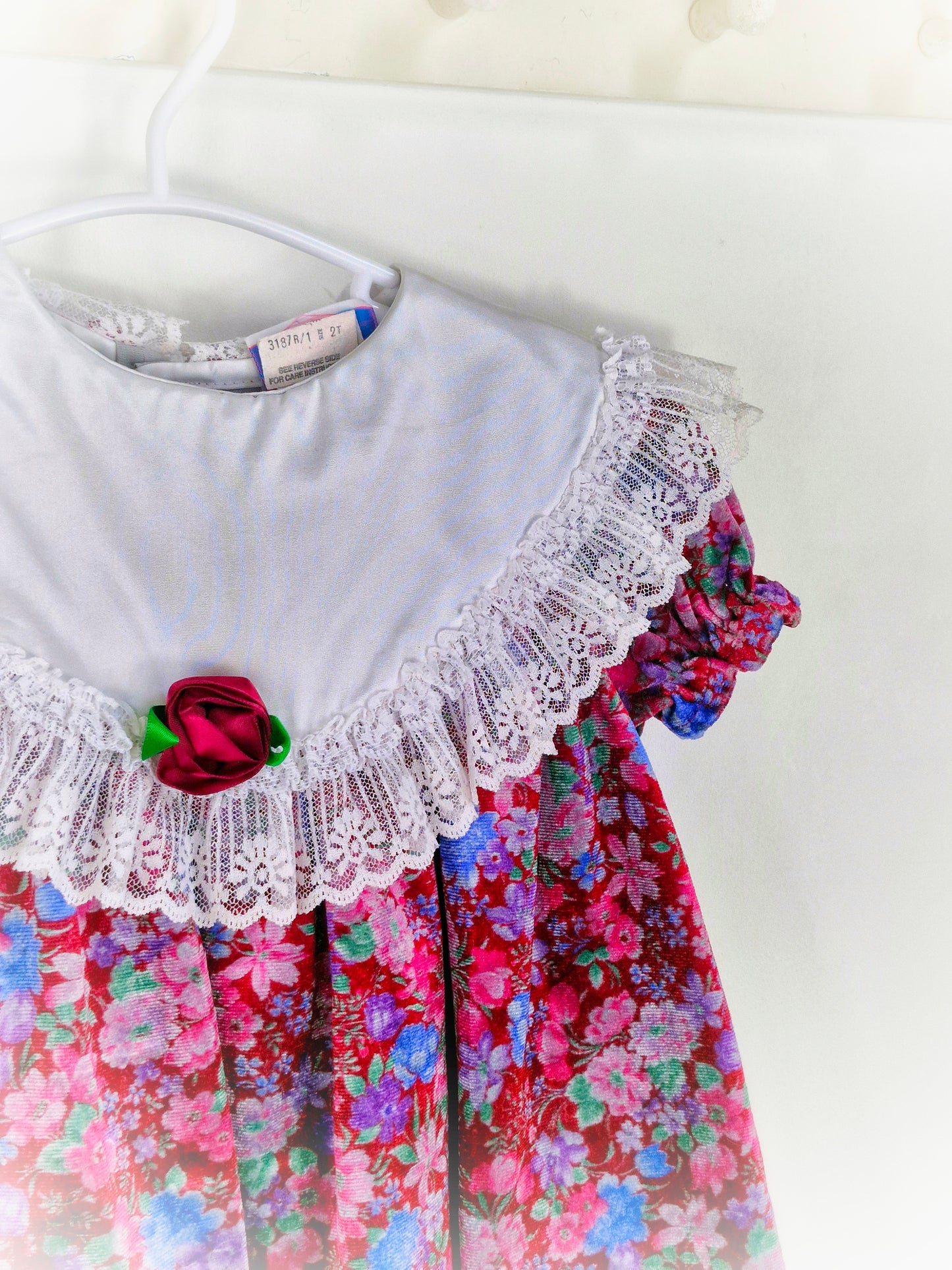 18-24 months. Vintage floral soft velvet dress with white bib and lace trim from Sweet Liberty