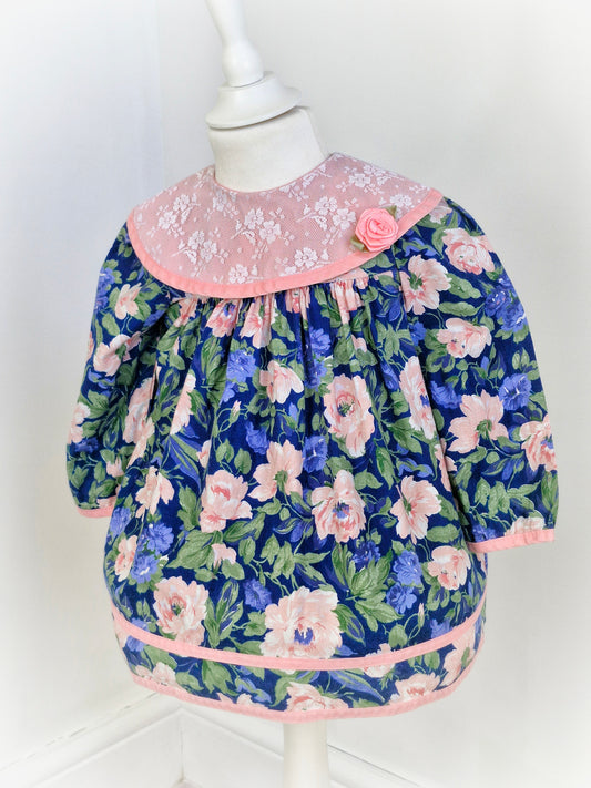 18-24 months. Blue and pink vintage floral dress with large pink lace bib