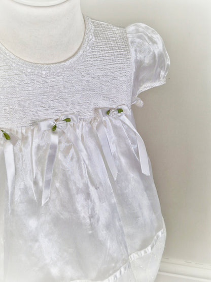 2 years. White satin and taffeta vintage dress from Rose Cottage with white bows and rosettes