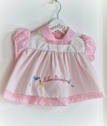 0-6 months. Pink and white vintage dress with embroidered "I love Grandma"