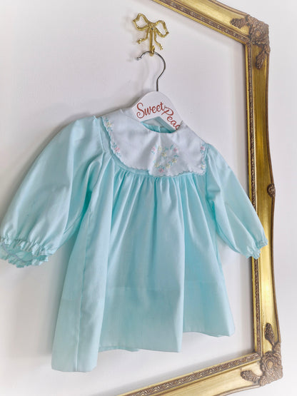 6-9 months. Mint vintage Alexis with white embroidered bib