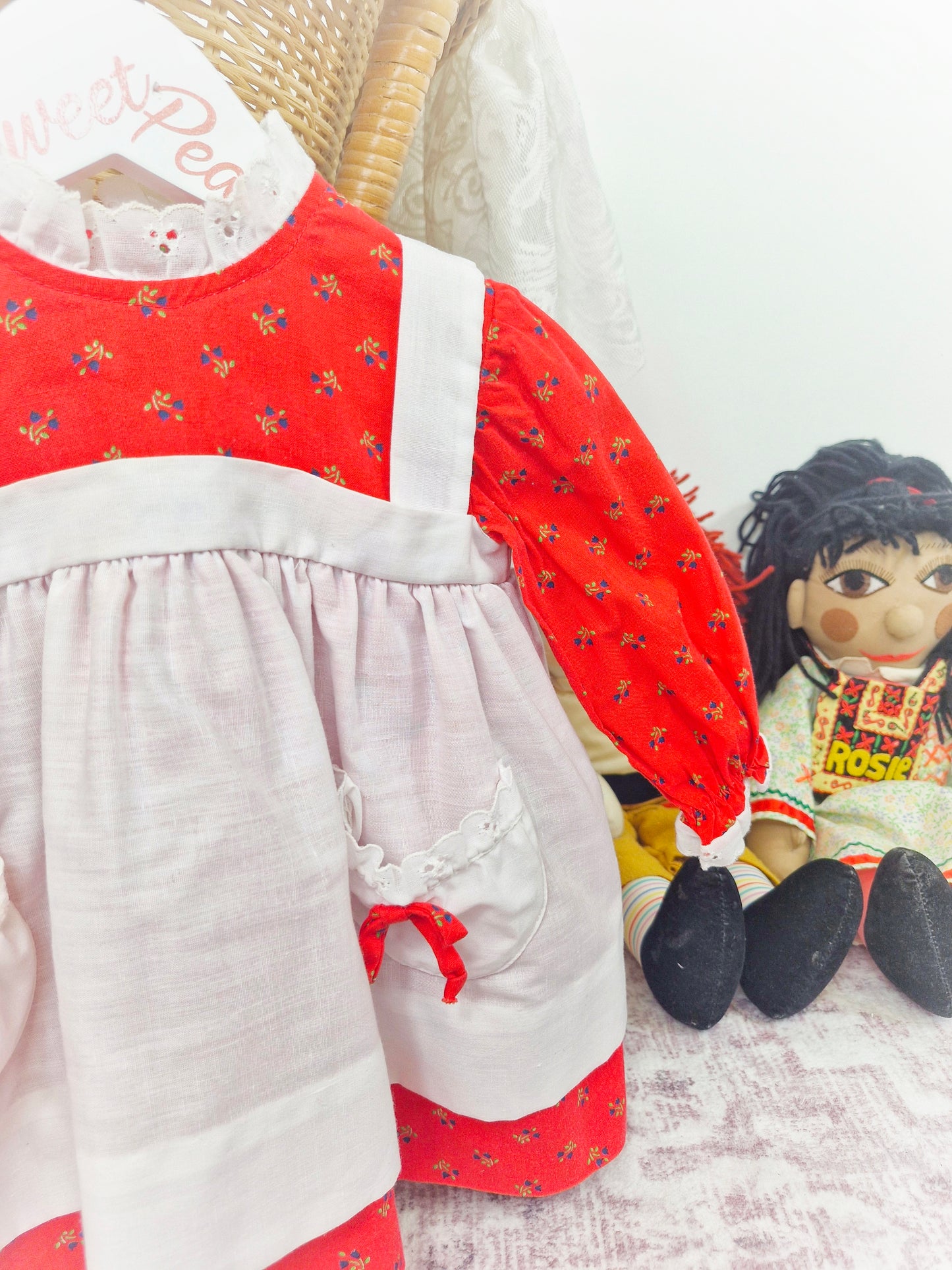 12 months. Long sleeve red floral vintage dress with white pinny