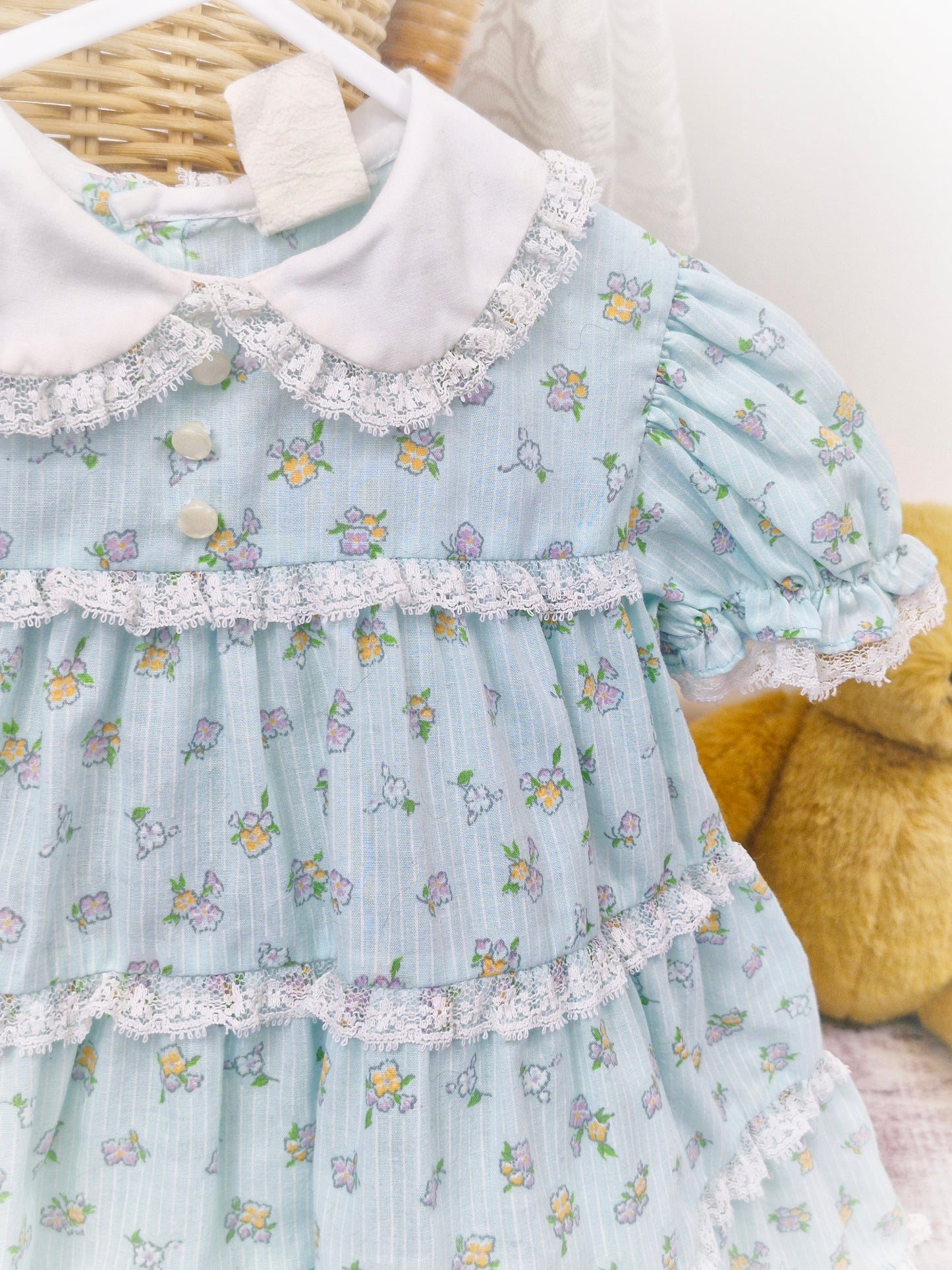 12-18 months. Light blue vintage floral dress with lace details