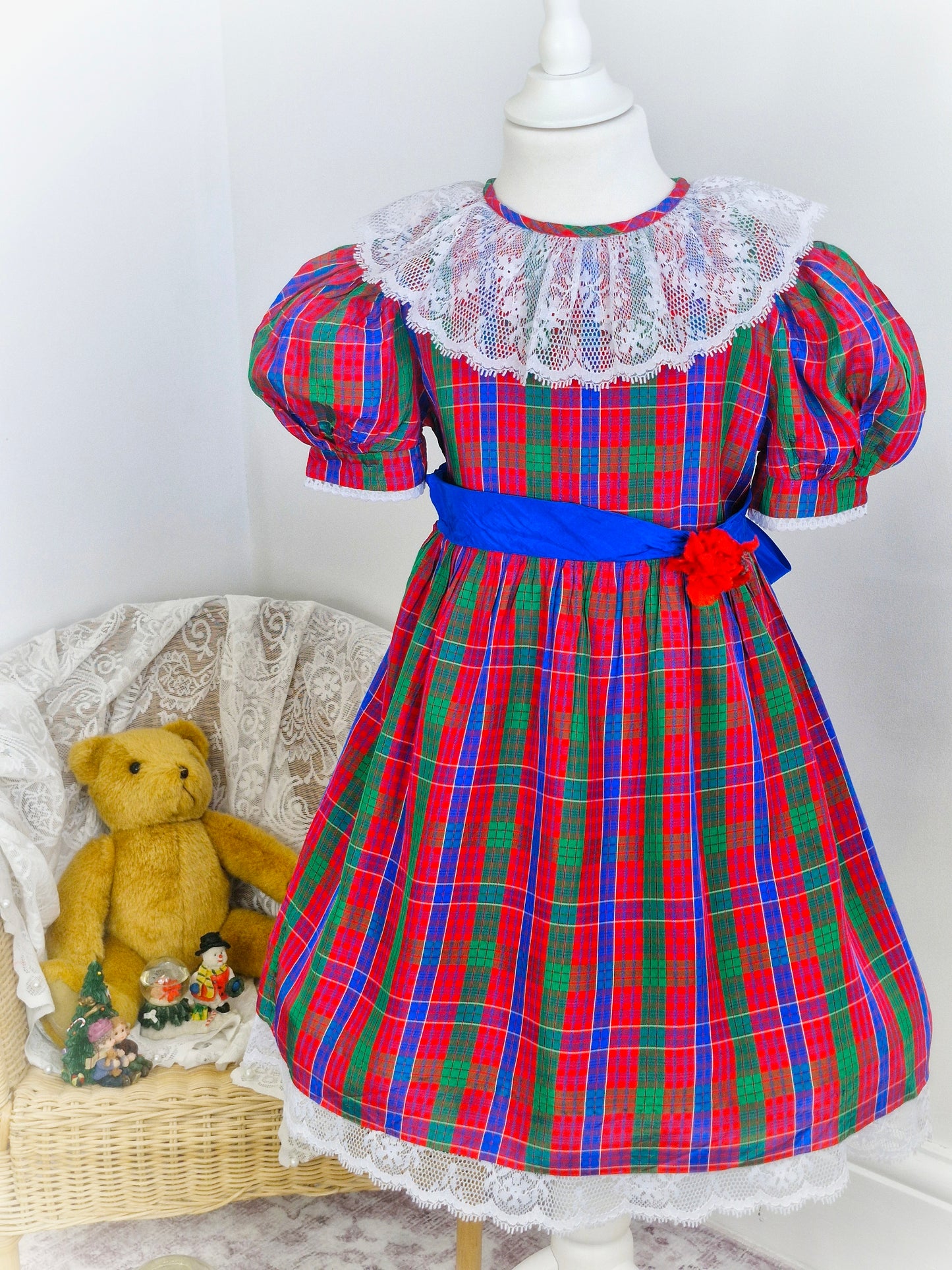 6 years. Red, blue and green Youngland tartan dress with white lace bib and hem