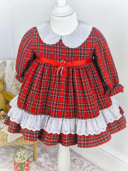 2 years. Red tartan dress with white collar embroidered with dainty flowers. Ribbon belt.