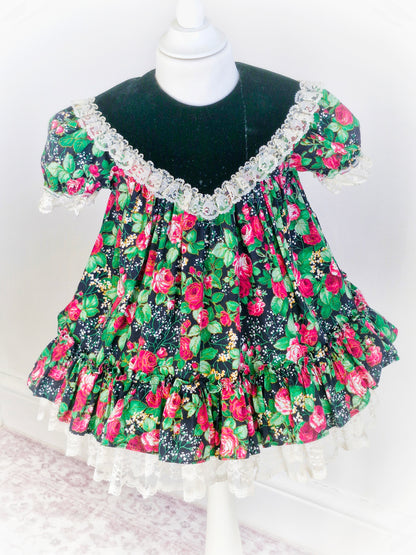 2-3 years. Vintage Jolene, black with red roses and green leaves. Minor faults on bib*