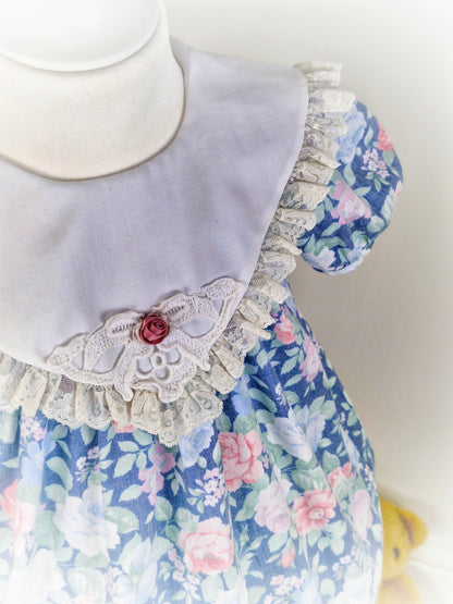 2-3 years. Blue floral vintage dress from Special Occasions with lace hem and bib