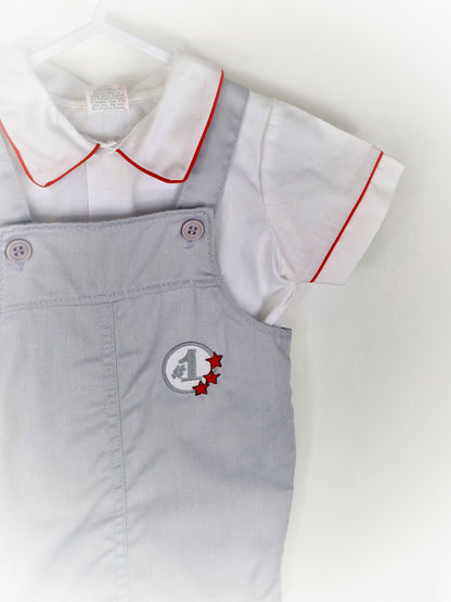 18-24 months. Two piece set, white shirt with red trim and grey dungarees