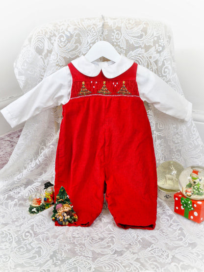 6-9 months. Two-piece set. Red corduroy dungarees with smocking and embroidered Christmas trees. Includes white collared shirt.