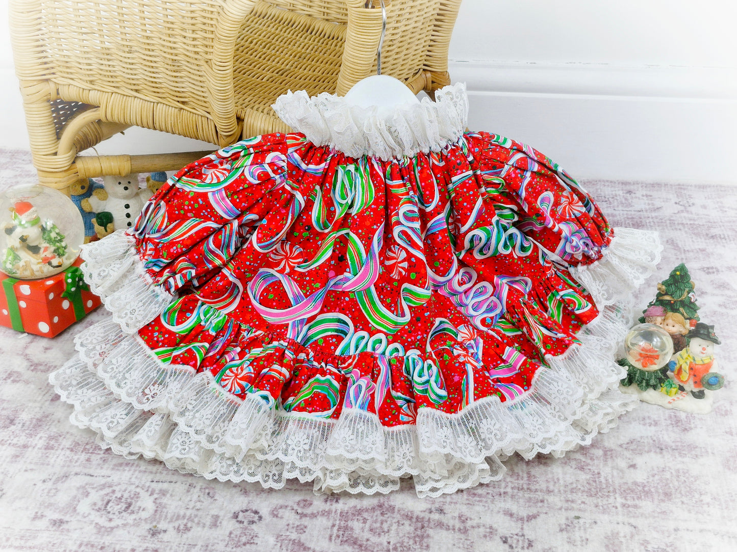 9-12 months. Brightly coloured handmade festive dress with puffed sleeves and a white lace trim