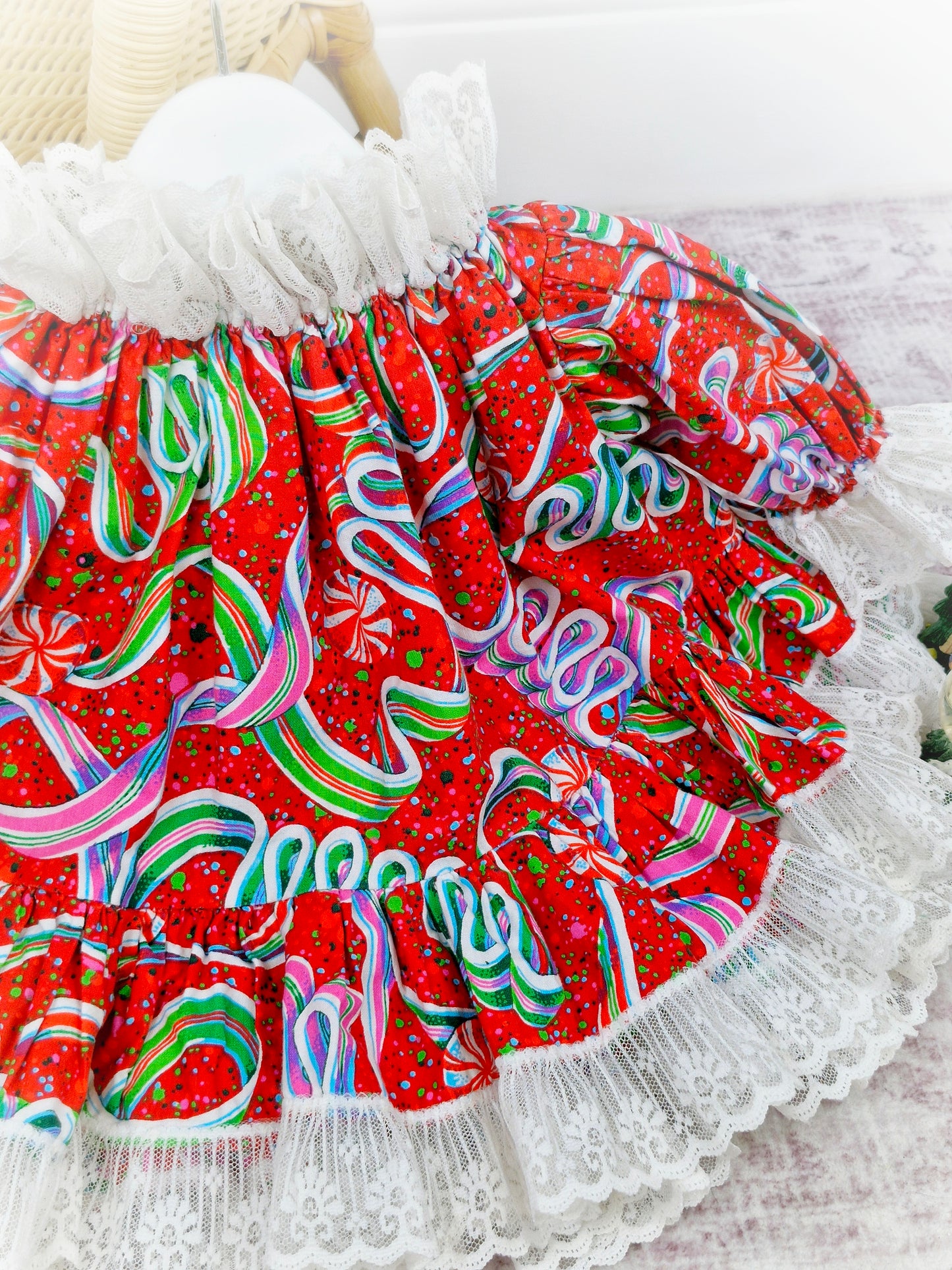 9-12 months. Brightly coloured handmade festive dress with puffed sleeves and a white lace trim