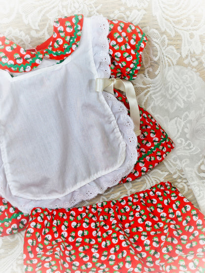 0-3 months. 3 piece set; dress, bloomers and pinny. Red with snowman print. Handmade.