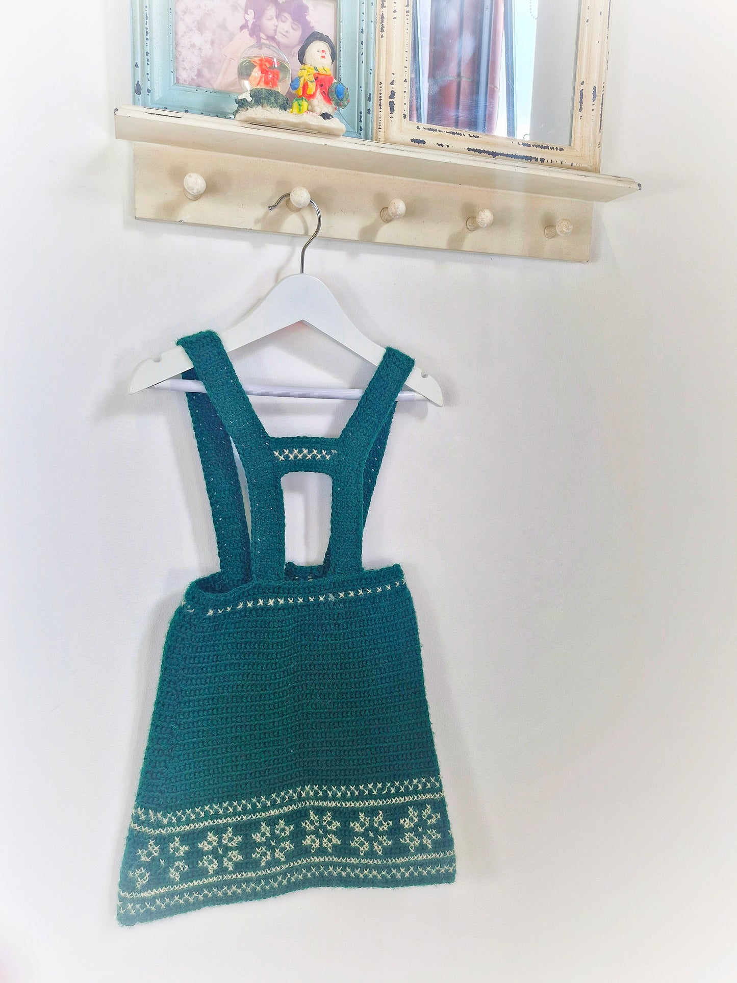 4 years. Dark green knitted pinafore dress with snowflake patterns. Handmade