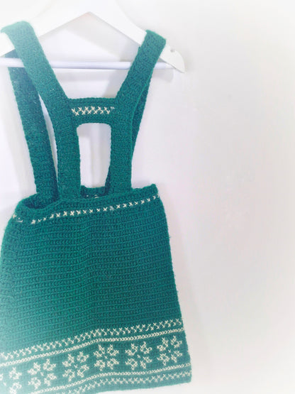 4 years. Dark green knitted pinafore dress with snowflake patterns. Handmade