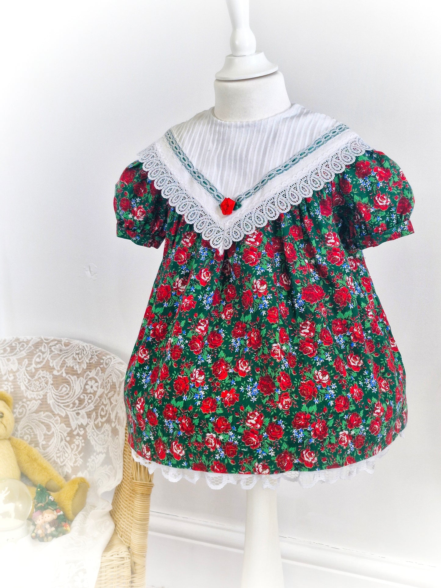 2 years. Red and green Christmas dress, white bib with lace hem by Youngland