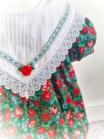2 years. Red and green Christmas dress, white bib with lace hem by Youngland