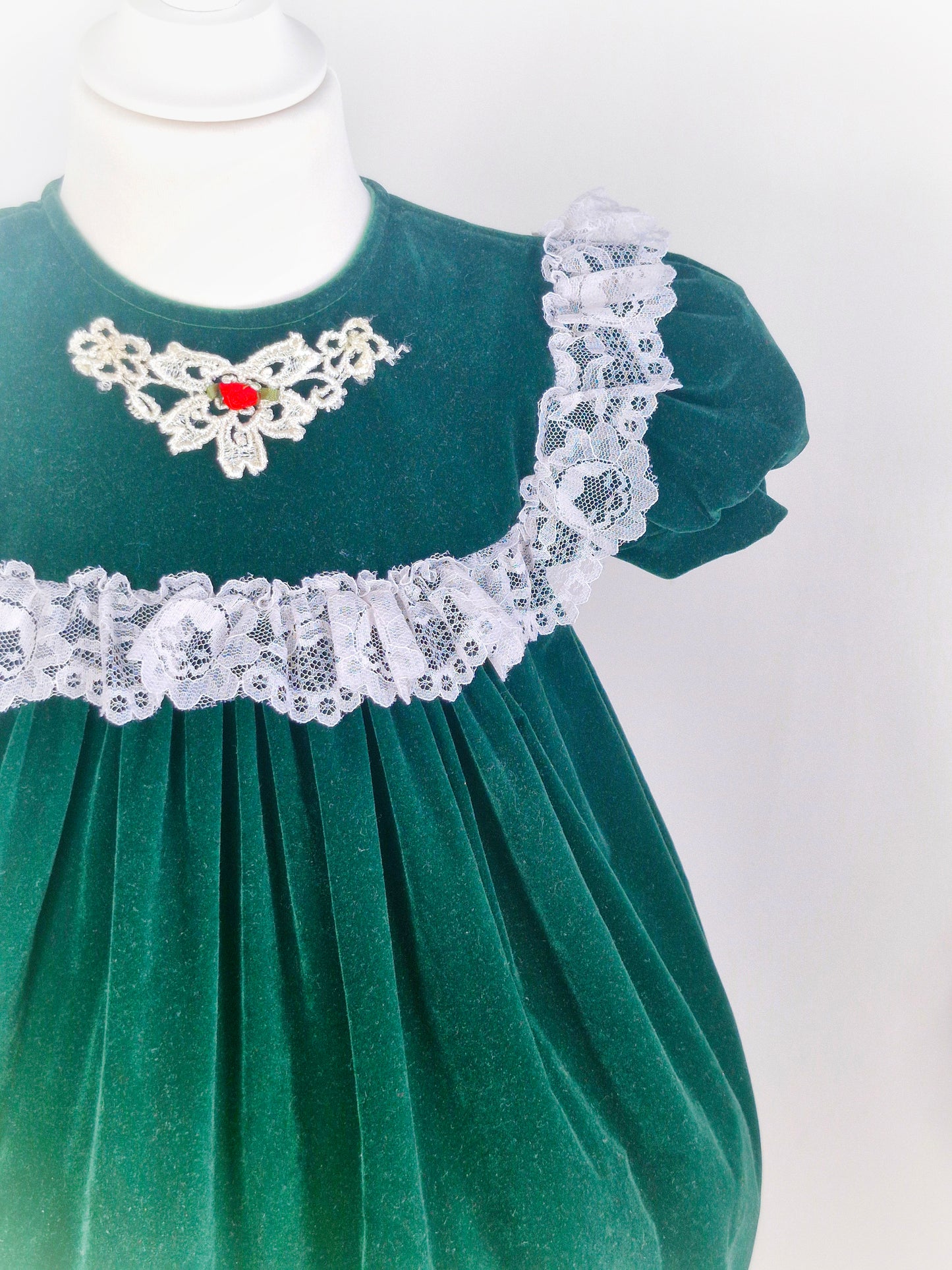 3 years. Dark green velvet dress, JoLene brand. Lace trim and hem