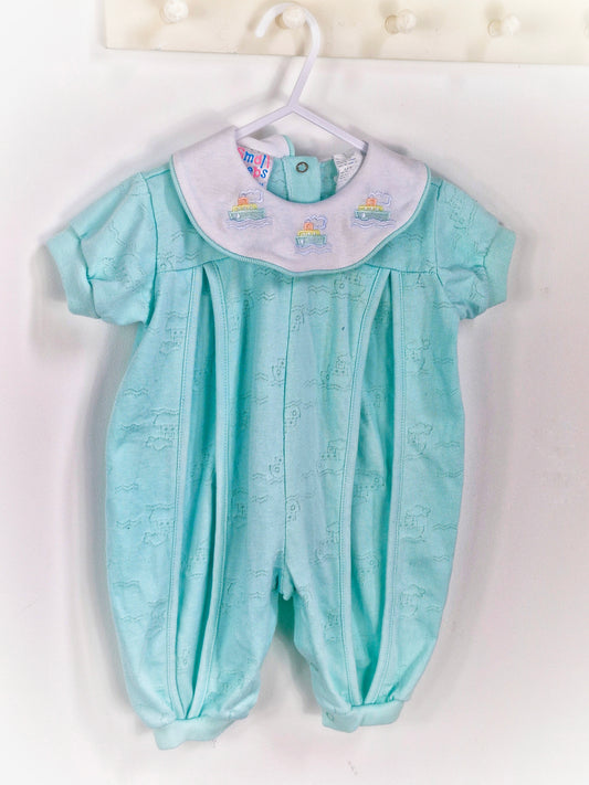 6-9 months. Mint romper with embroidered boats on collar. Small steps