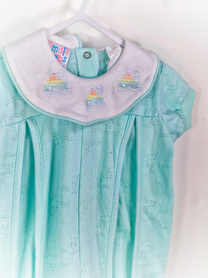 6-9 months. Mint romper with embroidered boats on collar. Small steps
