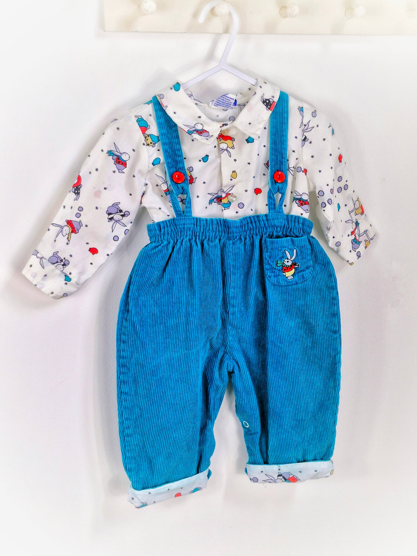 12-18 months. Two-piece set. Teal corduroy dungarees with embroidered bunny, matching bunnies on shirt, winter themed