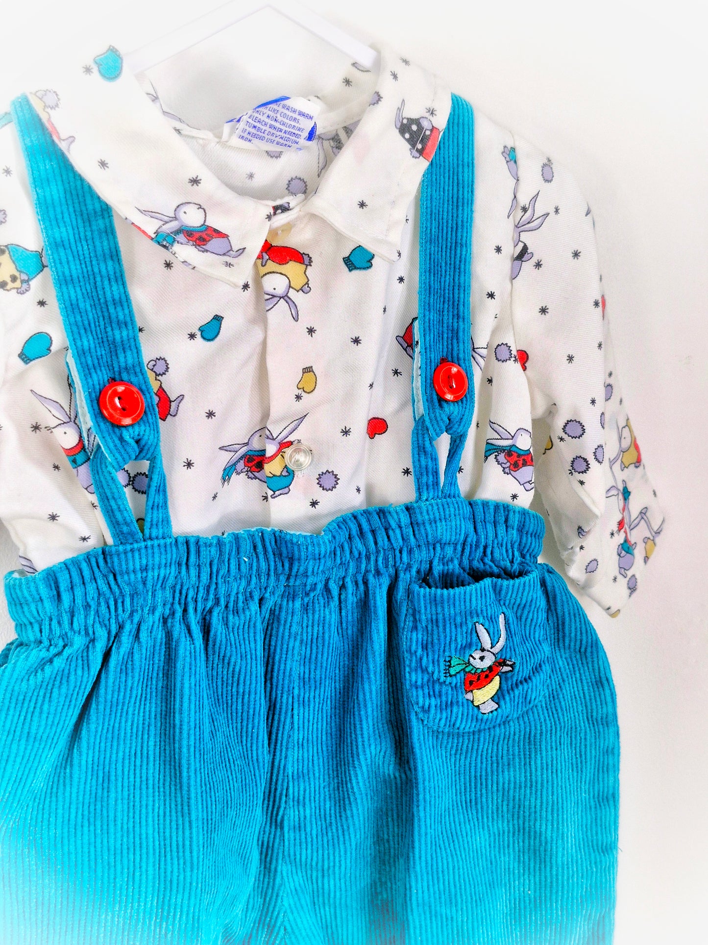 12-18 months. Two-piece set. Teal corduroy dungarees with embroidered bunny, matching bunnies on shirt, winter themed