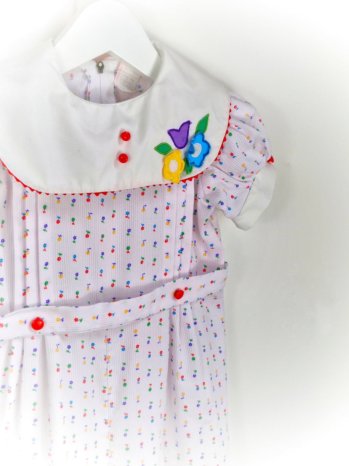 18-24 months. White vintage romper with floral stripes, white bib and flower applique